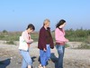 SundownIsland > Monique Wells, Linda Olson and daughter Rebekah try to dry off after a wet ride to the island. (Photo credit: Steve Tripp)