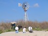 SundownIsland > Ed Olson (tractor) returns from a work site, while Richard Brietzke, Barbara Van Horn, and Steve Tripp head out to a new tree plot. (Photo credit: Steve Tripp)