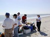 SundownIsland > Volunteers begin to eat the lunch provided by the workday sponsor, Devon Energy Corp. L to R: Steve Tripp, Jennifer White, Dale Blakeman, Abe Moore and Lynn Travis. (Photo credit: Hannah Olson)
