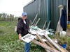 SundownIsland > Peggy shows off the new pond signs made by her Dad, Chester Smith and volunteer Charlie Cravey.