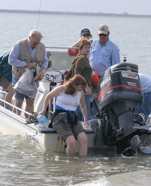 SundownIsland > Devon volunteer Molly Eskelson gets her feet wet preparing to come ashore.  (photo by Steve Tripp)