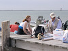 SundownIsland > Molly Eskelson and Capt. Bob Hill.  Capt. Hill provided boat transportation for some of the volunteers.  (photo by Steve Tripp)