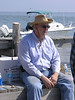 SundownIsland > Gary Eskelson takes a break from his tractor duties.  One of these is to broadcast fire ant killer over large areas of the island.  (photo by Steve Tripp)