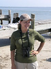 SundownIsland > Peggy Wilkinson watches the "Unusual Trash Found" display.  (photo by Steve Tripp)