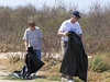 SundownIsland > Barbara Van Horn and Jim Schuelke assist with beach cleanup after the lunch break.  (photo by Steve Tripp)