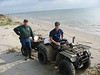 SundownIsland > Niell Irvin (Port Lavaca Government Land Office (GLO) and Chris Bouley (Coast Guard) arrived before most of volunteers and already had the four wheeler and trailer on the beach, ready to haul supplies. (photo by Peggy Wilkinson)