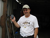 SundownIsland > Tim Wilkinson shows off his new PDA in front of the tractor shed. (photo by Peggy Wilkinson)