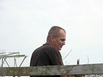 SundownIsland > Doug Wilkinson rolls up the fencing on this nesting stand. (Photo credit: Hannah Olson)