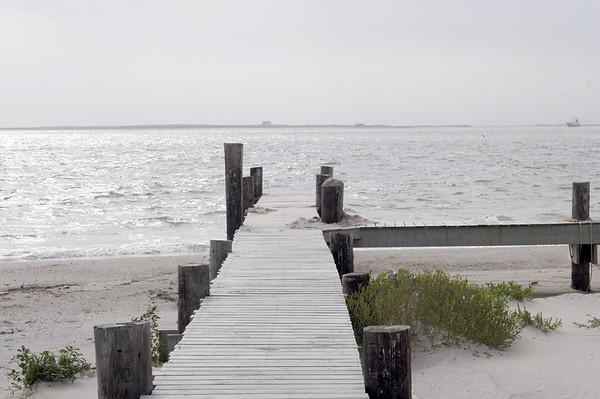 SundownIsland > A shot of the dock, sanded in. Chester Smith had the dredge crew sand in the dock because it was in danger of being completely washed out.  At a later time, the dock may be extended to make it easier to bring volunteers to the island. (Photo credit: Marcy Spears)