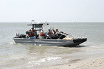 SundownIsland > The Government Land Office boat pulls out first to head back to Port O'Connor with Rob Muir, Niell Irvin, Mark Elwonger and Nelda and Abel DeLeon. They are also taking the trash collected along the beach to be disposed of properly.  (Photo credit: Marcy Spears)