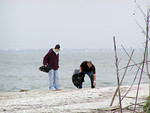 SundownIsland > Tyler and his Uncle Doug Wilkinson pick up trash along the East side of the beach. (Photo credit: Rebeka Olson)