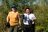 SundownIsland > Brenda Eskelson and Lynn Travis (Devon Energy) are ready to get started on the other tree plot.  This one is located not far from the windmill.  Photo credit: Marcy Crowe Spears