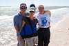 SundownIsland > Tim & Peggy Wilkinson, Lynn Travis.  Peggy is showing off her new Devon Energy bag.  Photo credit: Marcy Crowe Spears