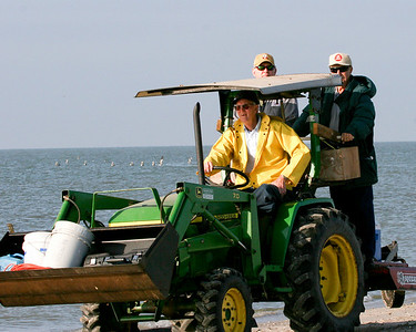 Ed Taylor (driving the tractor) picked up supplies brought in on the Egret II along with Ronnie Zetik and Robert Fairchild for the ride back to the shed.Photo credit: Marcy Spears