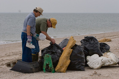 Robert Fairchild and Ronnie Zetik tie up the last pieces of trash picked up along the beach during workday.Photo credit: Marcy Spears