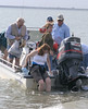SundownIsland > Devon volunteer Molly Eskelson gets her feet wet preparing to come ashore.  (photo by Steve Tripp)