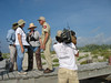 SundownIsland > Winnie Burkett and Chester Smith discuss how to divide up the island while David Newstead (far left) and Julia Garrett (center) listen.  Abe Moore from Texas Parks and Wildlife films for the special on Sundown Island.  Photo credit: Diane Nunley.